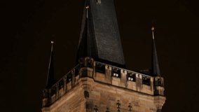 Gothic architecture of Charles bridge over Vltava river in  Czech Republic capital slow tilt 2160p UltraHD  video - Tilting on Lesser Town tower in Czechia city of Prague 3840X2160 UHD footage