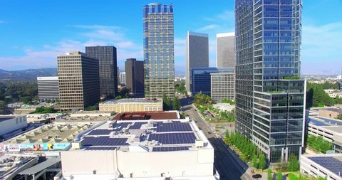 Aerial view of Century City and Fox Movie Studios using solar panels, Los Angeles, California, 4K