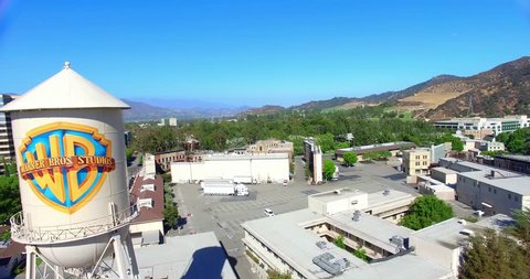 LOS ANGELES, CALIFORNIA, USA - JULY 29, 2015: Aerial view of Warner Brothers Movie Studios and Water Tower in Burbank on July 29, 2015 in Los Angeles, California, 4K