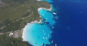 Antipaxos bay near Paxos island Corfu Kerykra Greece. Aerial video from a drone with boats and tourists swimming in water