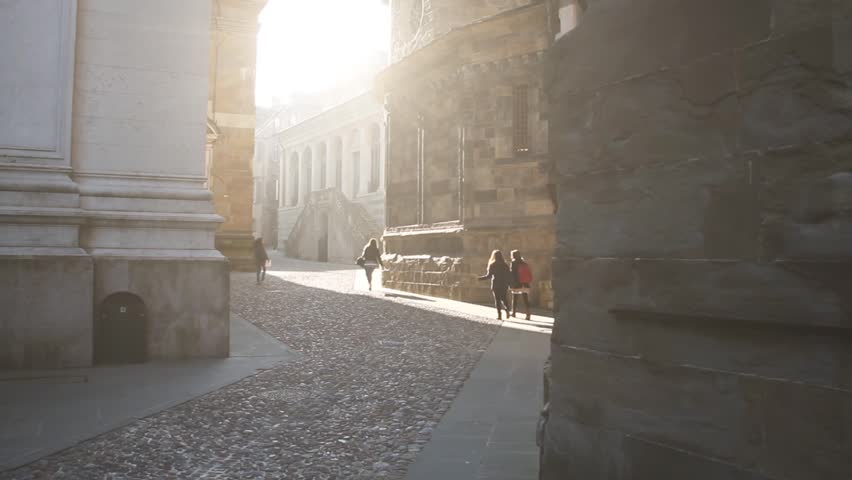 Italian street and people walking in slow motion