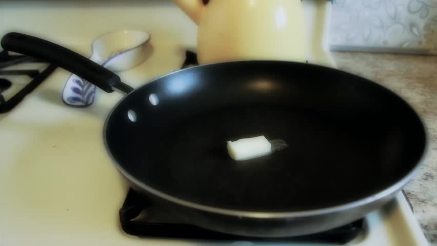 Cooking Fried Eggs in Frying Pan
