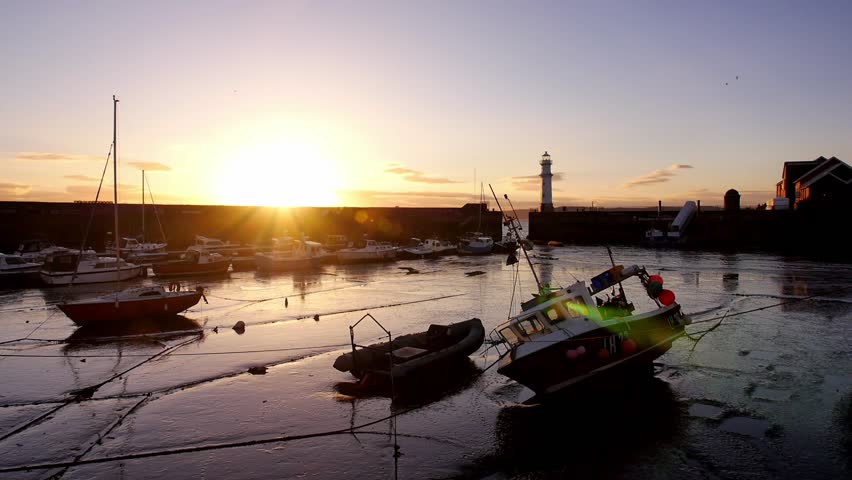 Boats lying on the sea floor at low tide in Edinburgh