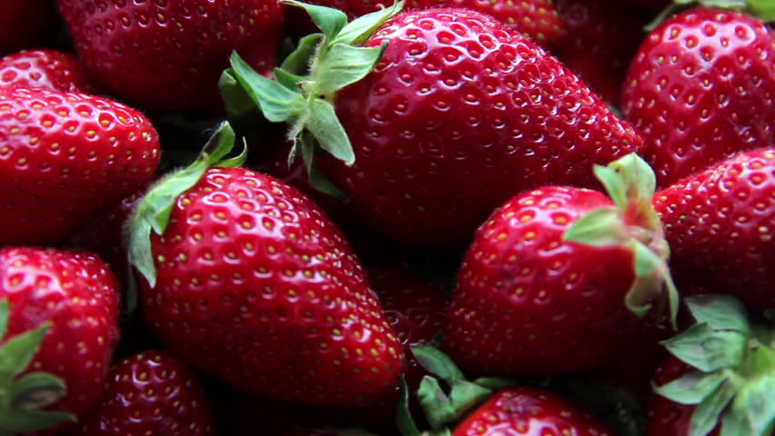 Fresh, ripe, juicy strawberries rotate. Red strawberries clockwise rotation