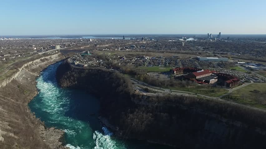 Niagara whirlpool sunny day overlooking downtown Niagara over water aerial