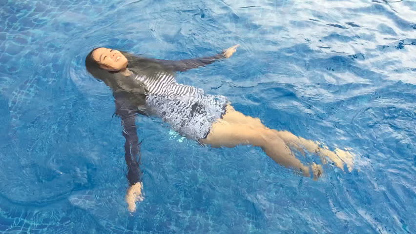 Relaxing of Asian teen swimming in the pool. Slow motion scene | Shutterstock HD Video #22728223
