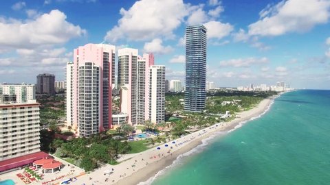 Flying over North Beach's white sandy beach with clear blue tropical ocean waters, Aerial view, Miami, Florida, USA Adlı Stok Video