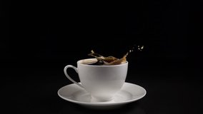 sugar cubes dropped into coffee creating splash - Powered by Shutterstock - Get 15% off with code: PIKWIZARD15