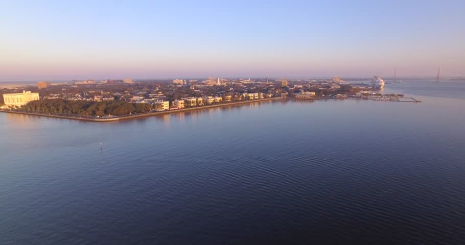 Aerial of Charleston Harbor and downtown at sunrise.