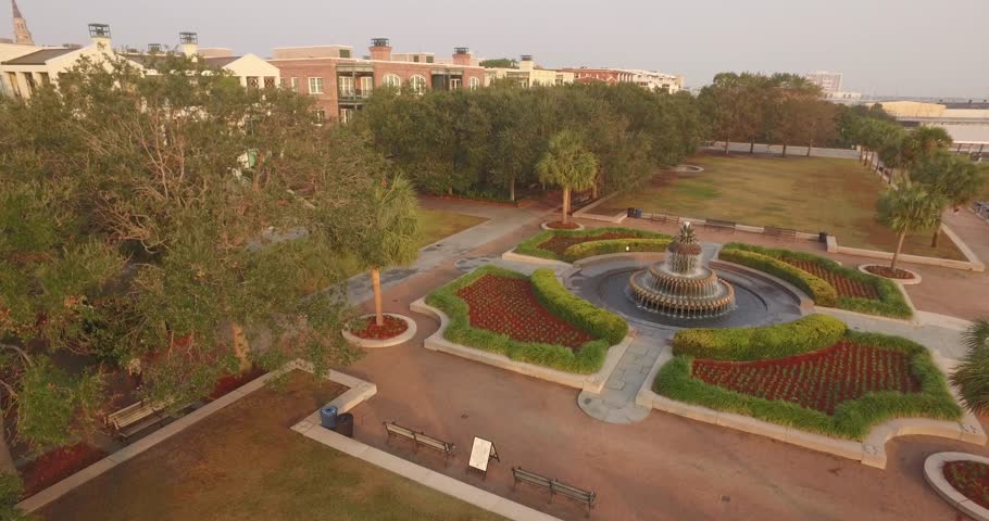 Aerial shot moving upward over Waterfront Park and the Pineapple Fountain in Charleston, SC.