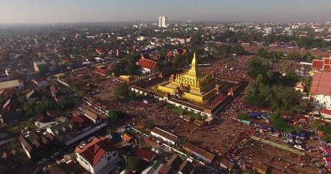 4K Aerial view of Phra That Luang Festival (Boun That Luang).Thousands of people flock to the grounds of Buddhist ceremonies and celebrations to pay respect to the golden stupa.Vientiane,LAOS . 2017