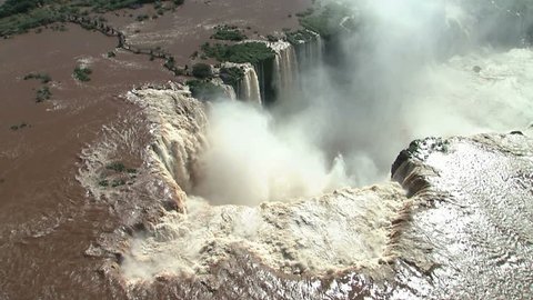 Iguazu Falls Aerial on Argentina/Brazil border as helicopter continues to move in to main fall, Garganta del Diablo