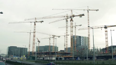 VIENNA, AUSTRIA - DECEMBER, 24 Steadicam shot of cranes at big construction site of The Icon luxury buildings in city center. 4K video