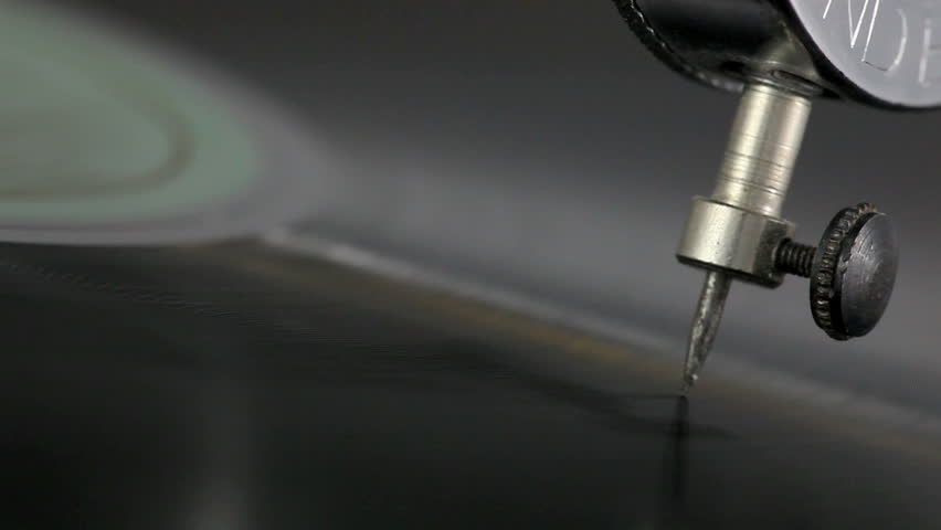 Close-up needle of a vintage gramophone playing a record