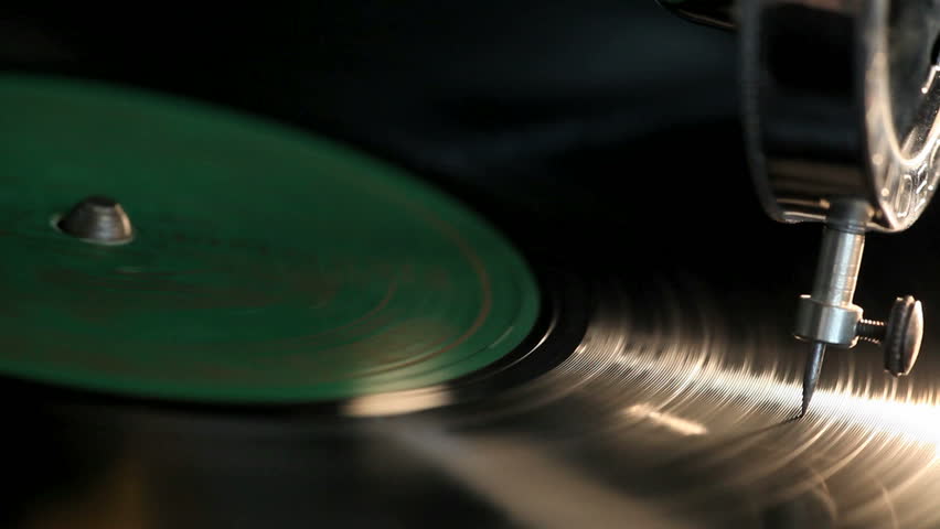 Close-up needle of a vintage gramophone playing a record