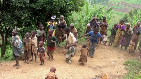 LAKE BUNYONYI, UGANDA - OCTOBER 21, 2012: Batwa pygmies dancing on October 21, 2012 at Lake Bunyonyi, Uganda. Pygmy people are ancient dwellers in the forests, they were known as The Keepers of the Forest.