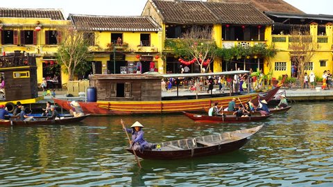 Hoi An, Vietnam - February, 2016: Wooden boats on the Thu Bon River in Hoi An Ancient Town (Hoian), Vietnam