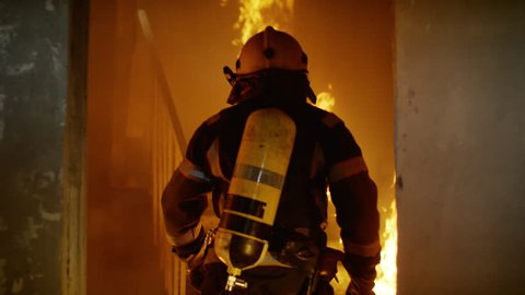 Two Brave Firefighters Go Up Burning Stairs. They Go Through Open Doors. Building is on Fire. Open Flames and Smoke Everywhere. Slow Motion.  Shot on RED EPIC 4K (UHD).