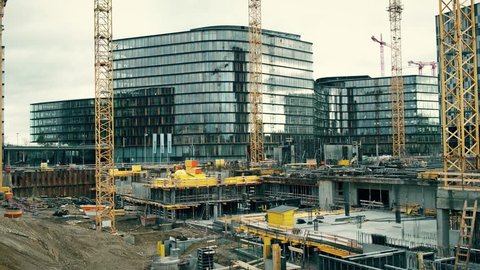 VIENNA, AUSTRIA - DECEMBER, 24 Steadicam shot of basement and cranes at big construction site of The Icon luxury buildings in city center. 4K clip