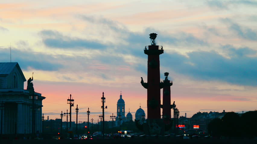 St Petersburg, Russia. Sunset over Strelka - Spit of Vasilyevsky Island with the Old Stock Exchange and Rostral Columns in Saint Petersburg, Russia