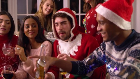 Group Of Friends Having Fun At Christmas Party Together Stock Video