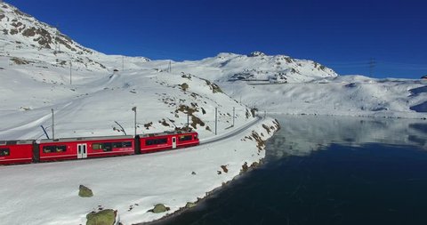 Red train on Bernina Pass in Winter season
