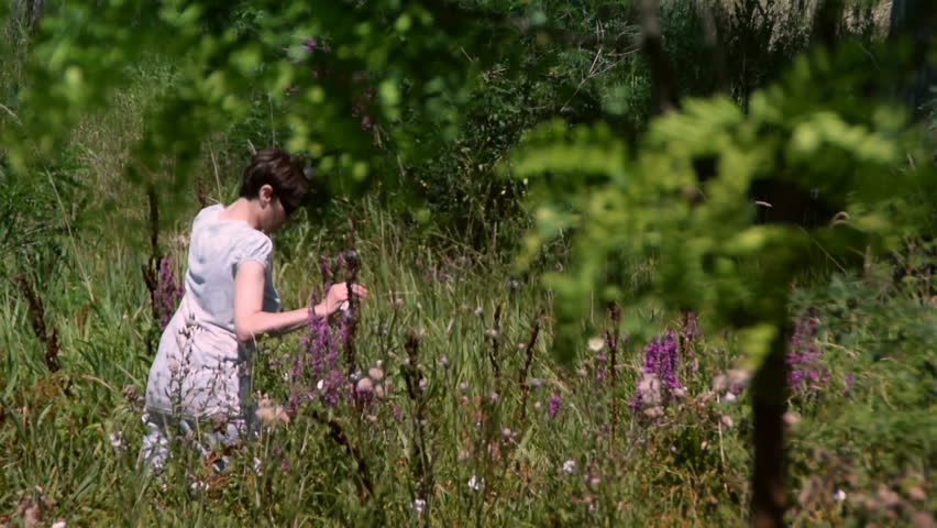 2 in 1 woman picking up flowers