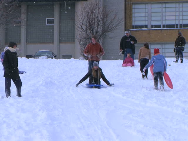 Teenagers Sled Riding 