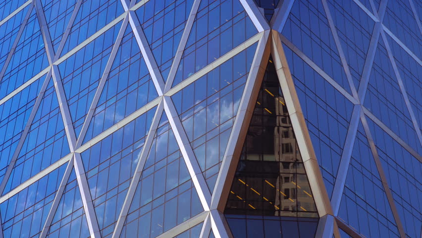NYC corporate skyscraper abstract detail exterior background close up glass facade blue sky clouds reflection windows pattern timelapse New York City