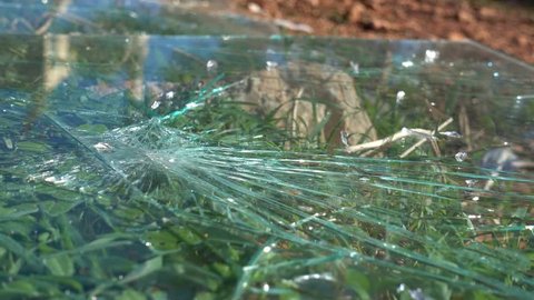 4K Smashed glass on the ground, close up
