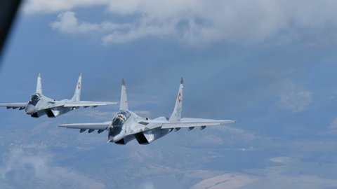 Cold War Combat Aircrafts in Flight. Mikoyan Gurevich MiG 29 Fulcrum of Bulgarian Air Force Air to Air 4K Ultra HD Video. The MiG-29 is a russian  military combat aircraft. Bulgaria 7th Oct. 2015.