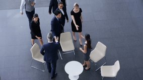 4K Overhead view business group meeting in large modern office building Dec 2016-UK - Powered by Shutterstock - Get 15% off with code: PIKWIZARD15