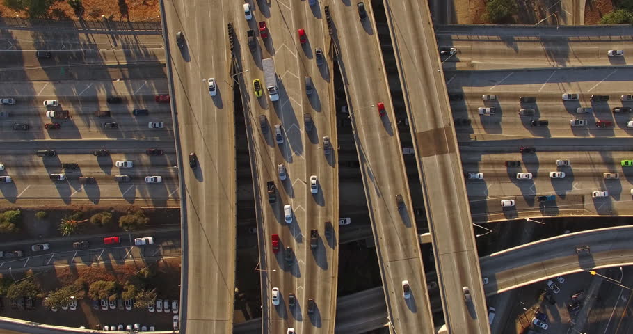 4K UHD vertical aerial top down view of heavy traffic on 10 freeway in Downtown, Los Angeles, California.