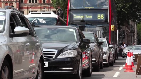 Great Britain, London, 11th of July 2015. Traffic in London with a lot of cars and red bus 88 going to Camden Town.