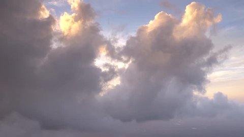 Evening Rain Clouds, Sunset AERIAL, 4k. Backlit rain and thunder clouds over S Florida. Features light RAYS from backlit sun.