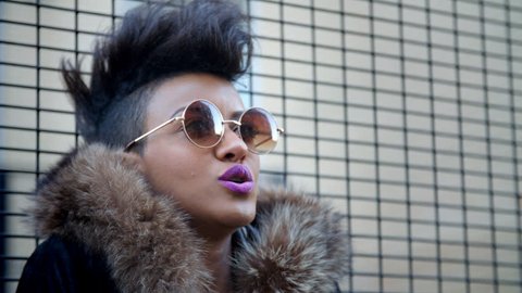 Stylish Fashion Blogger Stands By Fence In Urban Street Video Stok