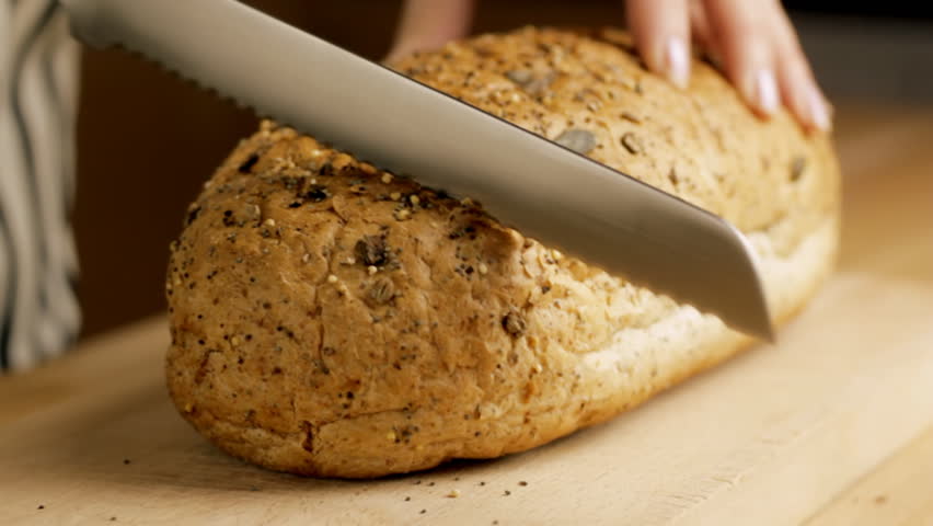 Slicing Wholegrain Bread Loaf