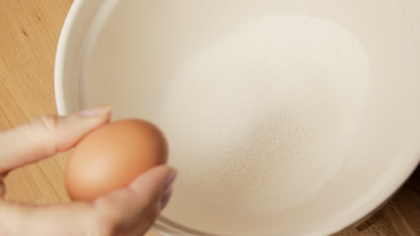 Cracking egg into bowl