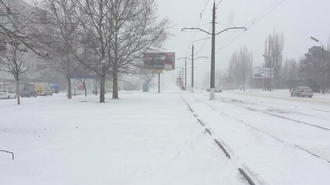 By tram rails moving tram for snow removal in heavy storm
Ukraine, Central Europe