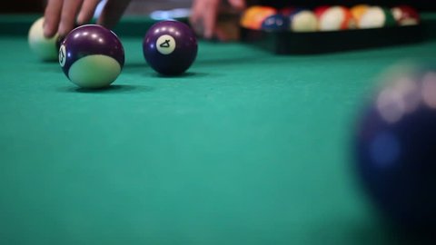 male hands setting up balls pool billiards table