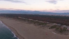 Aerial shot, gorgeous calm sea in the sunset light  filmed with drone
