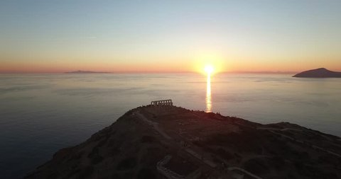 Aerial shot of the temple of Poseidon in Athens during sunset time