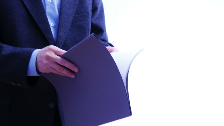 Businessman hands over a folder with papers