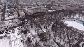 City Kiev, Ukraine aerial view. Winter snow. Governmental district: the Supreme Council, the Cabinet of Ministers, the Dynamo football stadium, the Mariinsky park. Aerial video