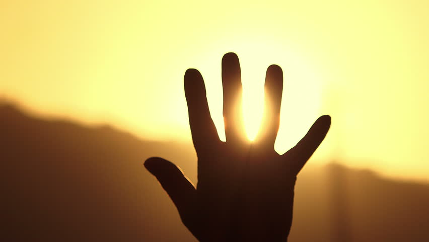 Hand in backlight is sheltering from the sun | Shutterstock HD Video #22876051