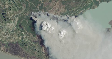 Aerial zoom out over the 2014 Funny River fire, Kenai Peninsula, Alaska. Elements of this image furnished by NASA.
