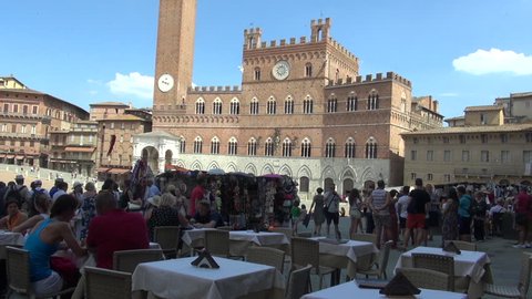 SIENA, ITALY - AUGUST 12 :Town Hall on main square in Piazza del Campo on August 12, 2016 in Siena, Italy. Piazza del Campo is historic center of city and is one of Europe's greatest medieval squares.