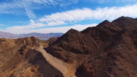 Eilat, Israel - Aerial footage over Solomon's mountains, revealing Eilat's skyline and the red sea