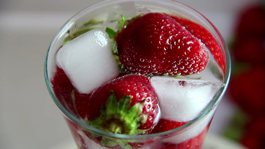 Strawberry ice water with fresh berries. Strawberry mojito drink with 
