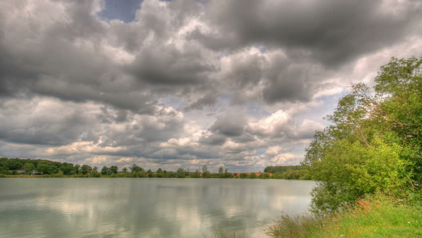 Clouds over lake, HD time lapse clip, high dynamic range imaging (hdr)
